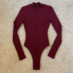 Fashion Nova Burgundy Long Sleeve Zip Up Bodysuit